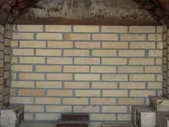 Firebrick and refractory cement lining an old steel mill furnace