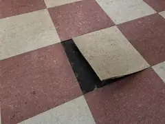 Old 9 inch vinyl asbestos floor tiles with black mastic underneath