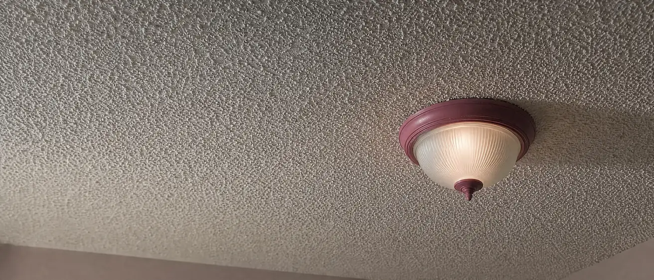 Textured popcorn ceiling in an older home that may contain asbestos